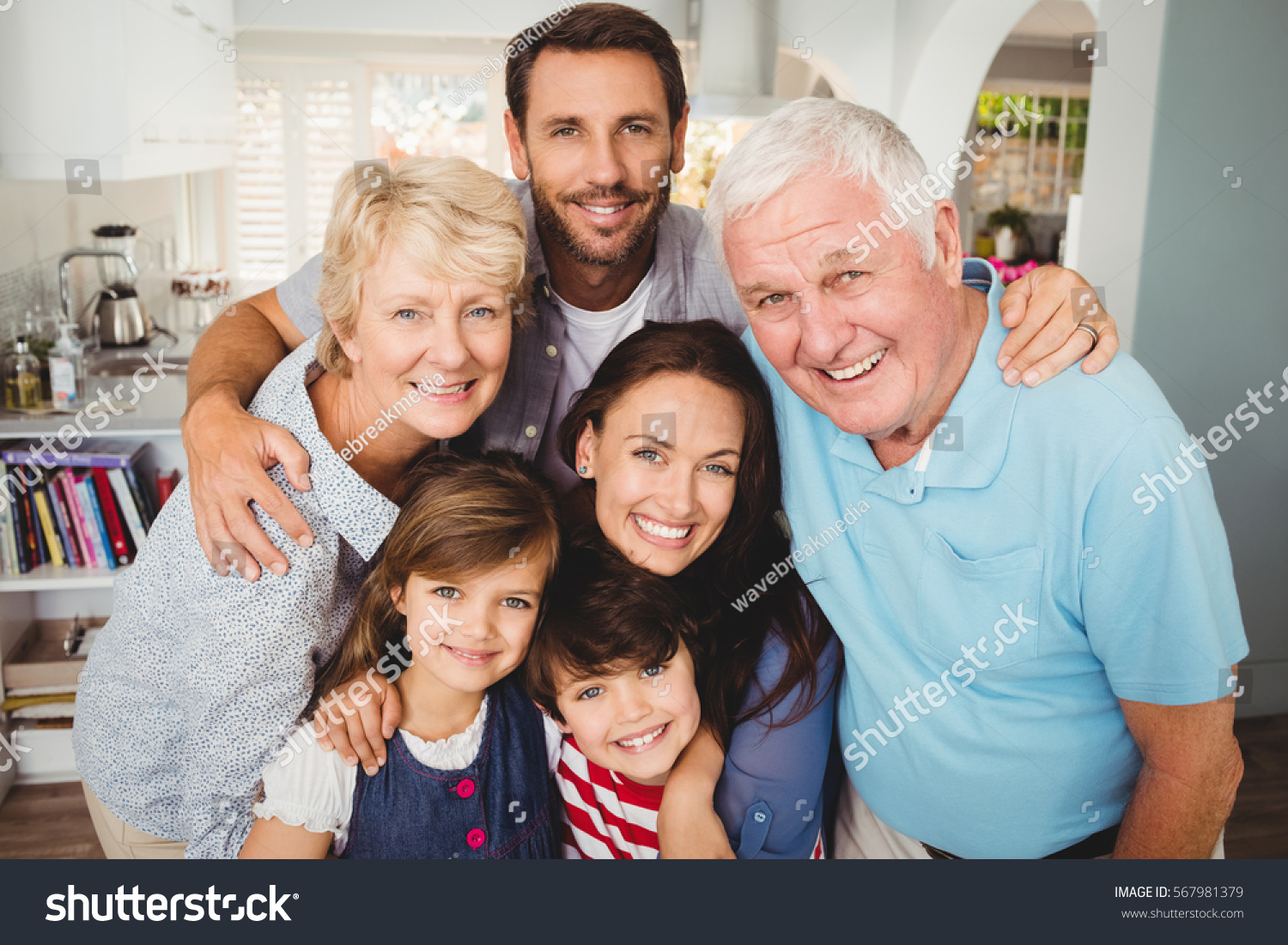 Portrait of smiling family with grandparents at home #567981379