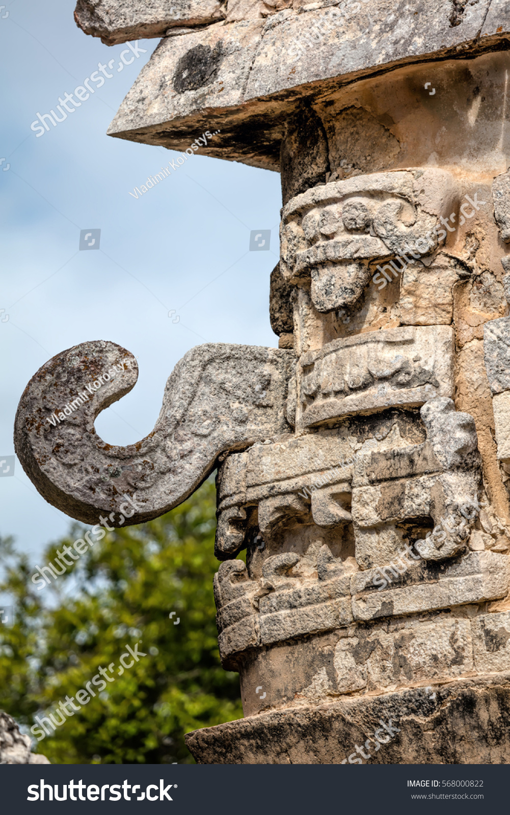 Three-dimensional mask on the edge of the Nunnery Annex building in Chichen Itza, believed to be the Ancient Mayan god of rain and lightning Chac. #568000822