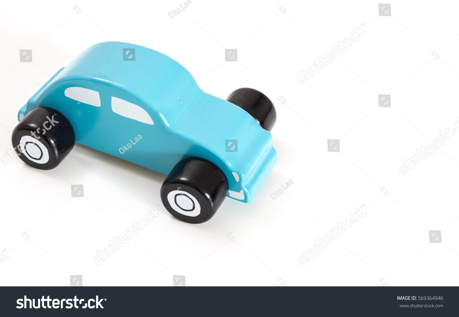 A blue toy car, on white background with copy-space. #569364946