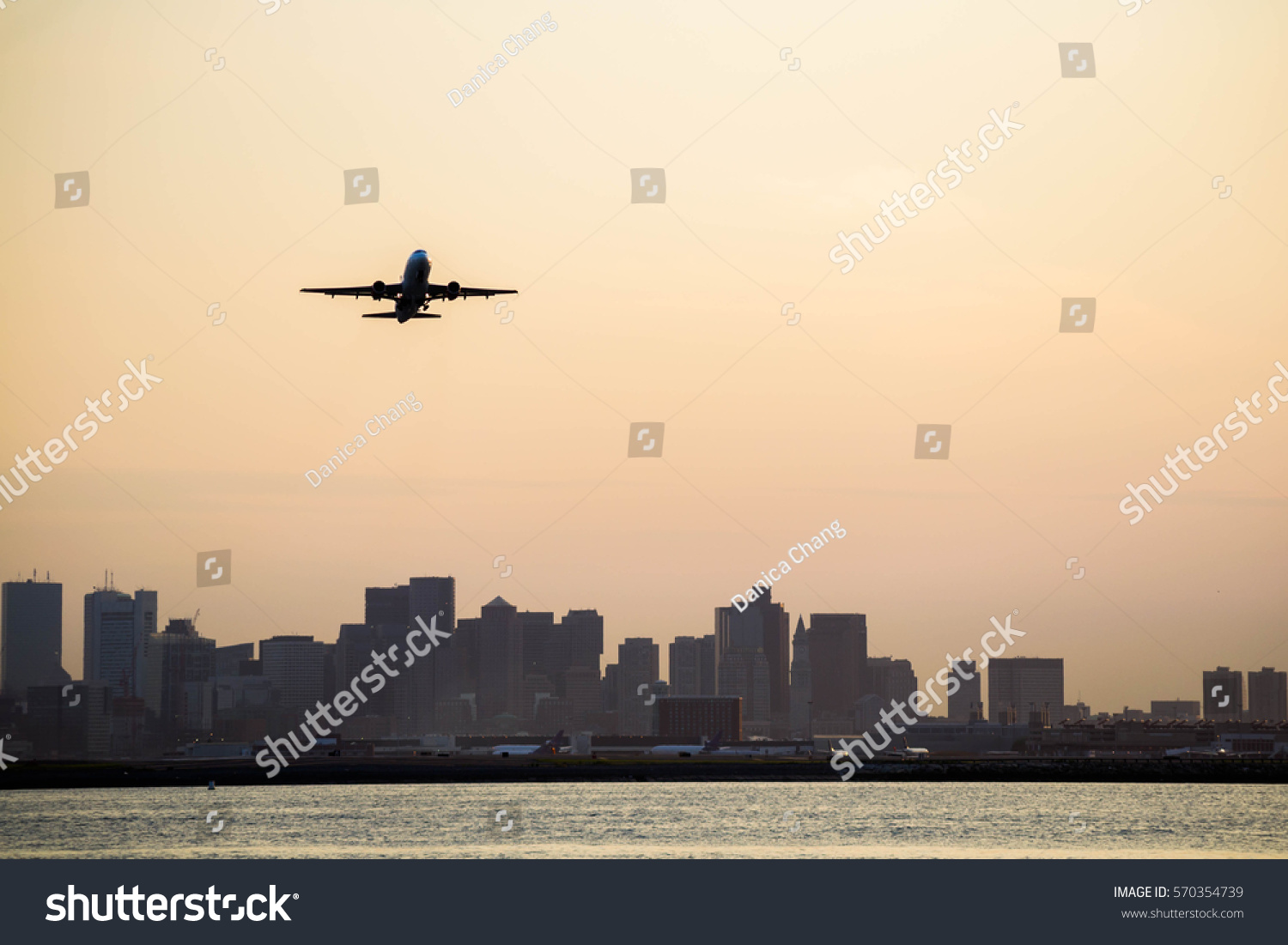 Airplane taking off from Boston Logan International Airport #570354739
