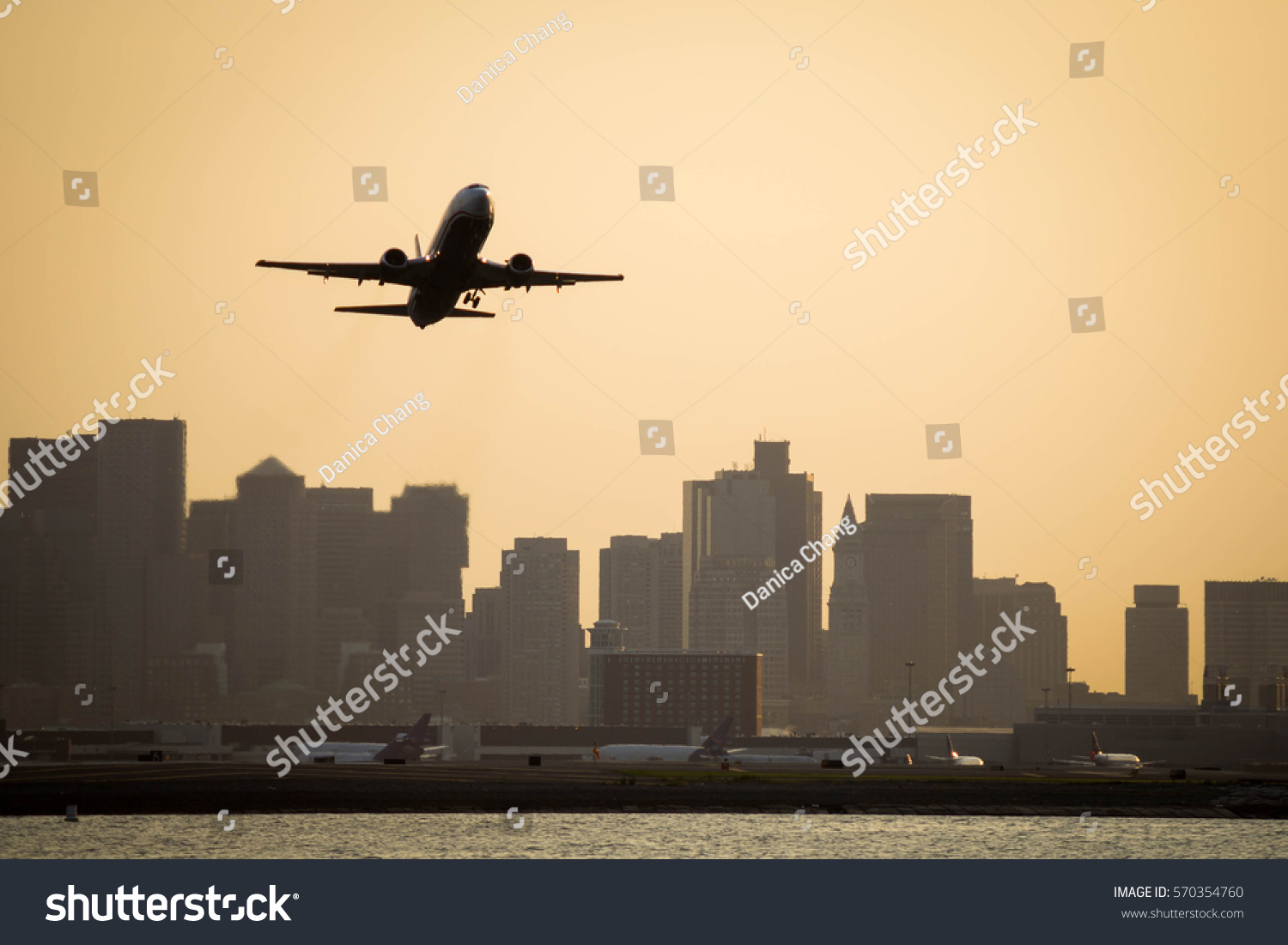 Airplane taking off from Boston Logan International Airport #570354760