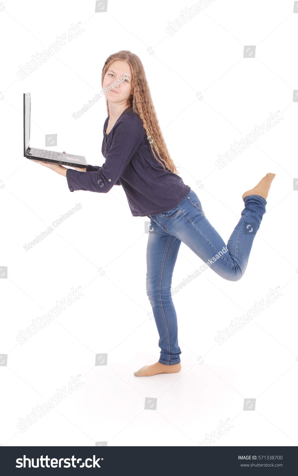 Smiling student teenage girl with laptop isolated on white #571338700