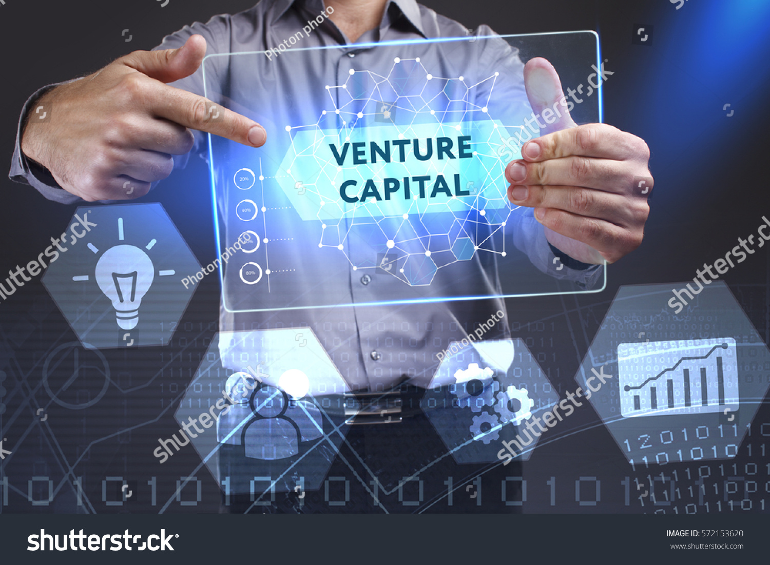 Business, Technology, Internet and network concept. Young businessman showing a word in a virtual tablet of the future: Venture capital #572153620