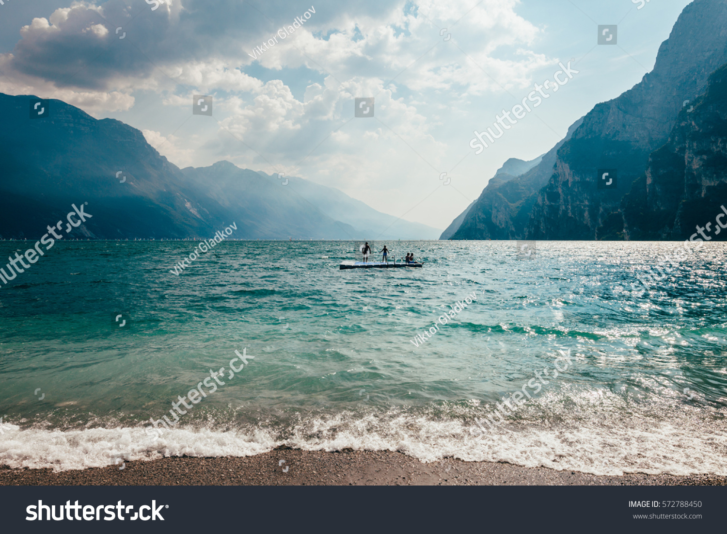 Scenic landscape of beautiful Garda lake and mountains, Italy. Nature background #572788450