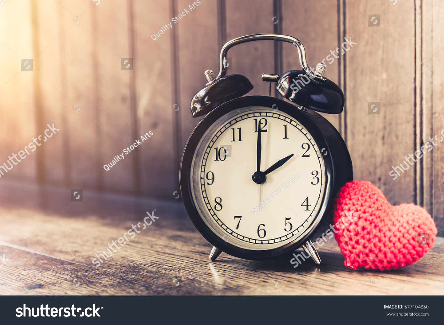 Love clock vintage tone timed 2 o'clock, Time of sweet loving past memories story on the old wood background. #577104850