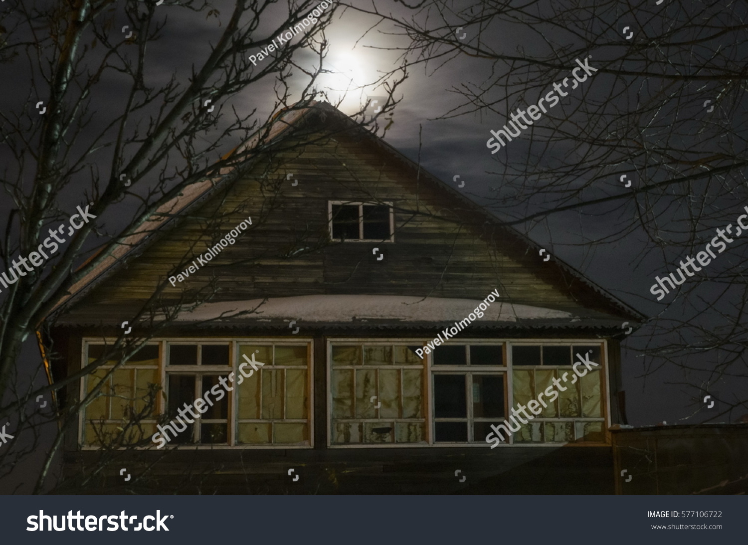 Old abandoned house in the light of the moon #577106722