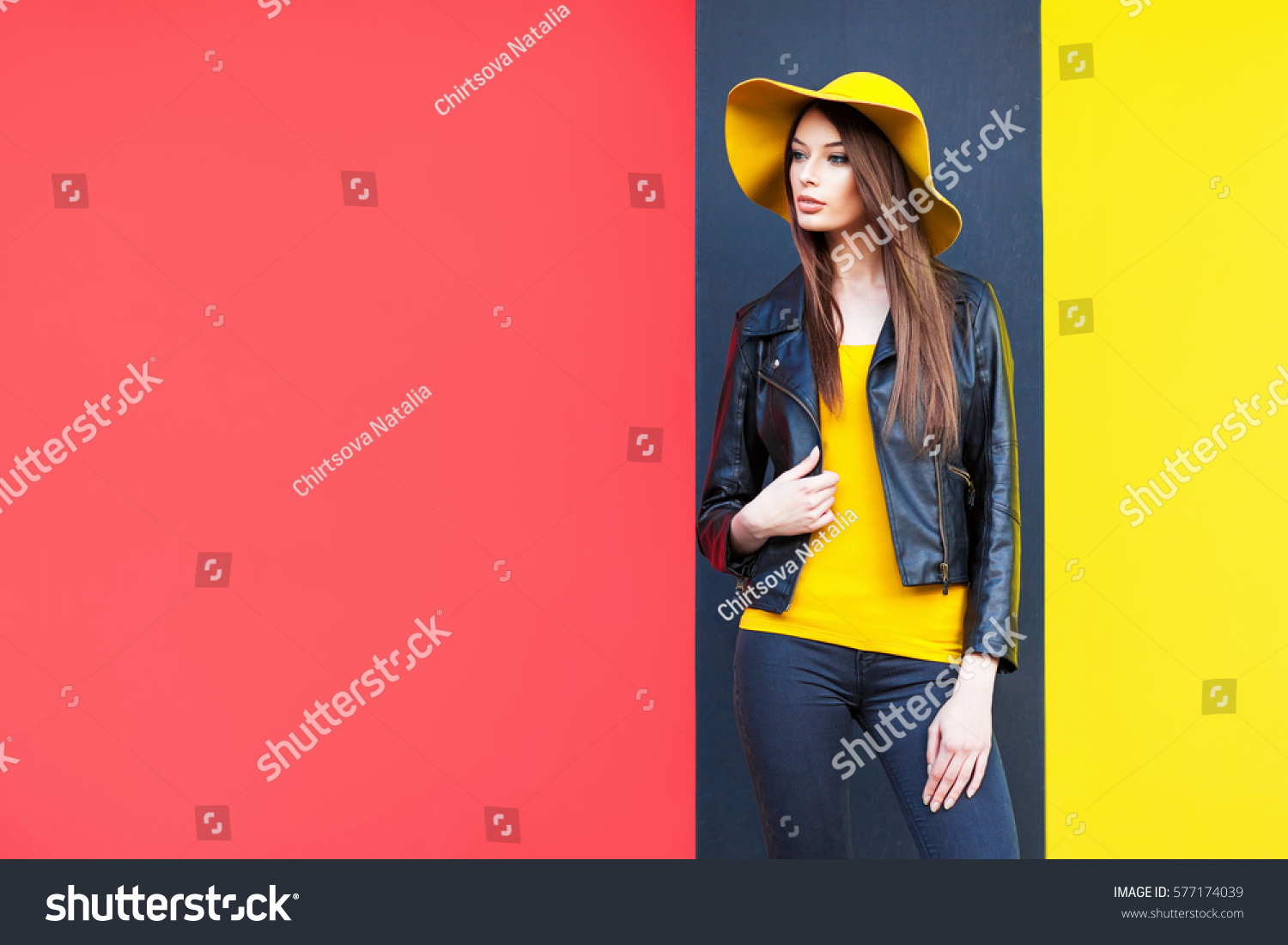 Beautiful young woman in yellow hat #577174039