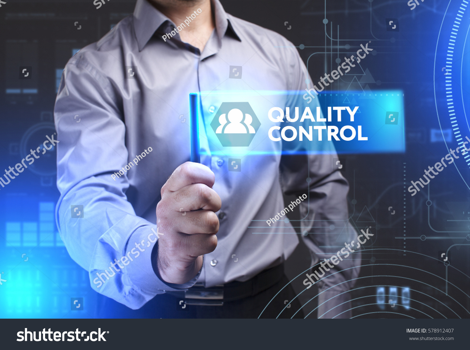 Business, Technology, Internet and network concept. Young businessman showing a word in a virtual tablet of the future: Quality control #578912407