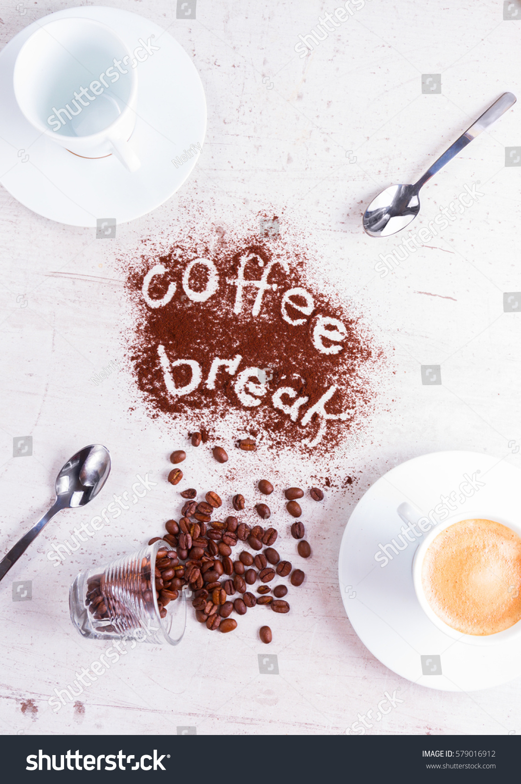 coffee break concept - empty cup and cup of espresso with coffee break lettering #579016912