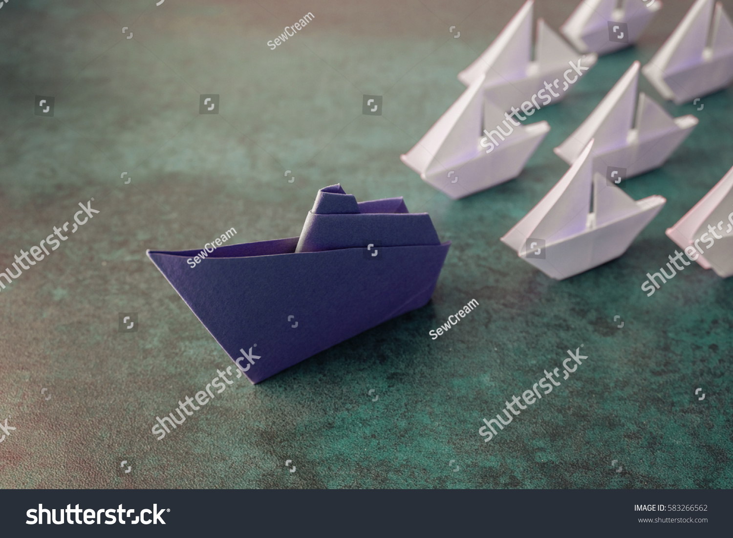 Origami paper ship boats, success leadership, strategy planning development, social media influence marketing, HR recruiter, disruptive innovation, breakthrough business model solutions concept #583266562