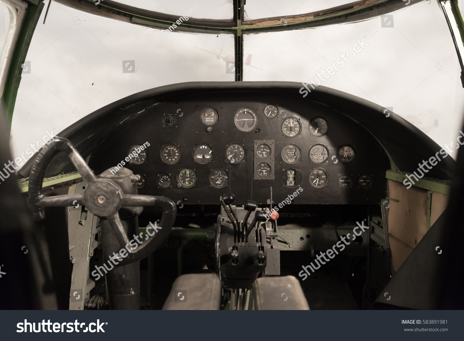view of an antique WW II bomber cockpit #583891981