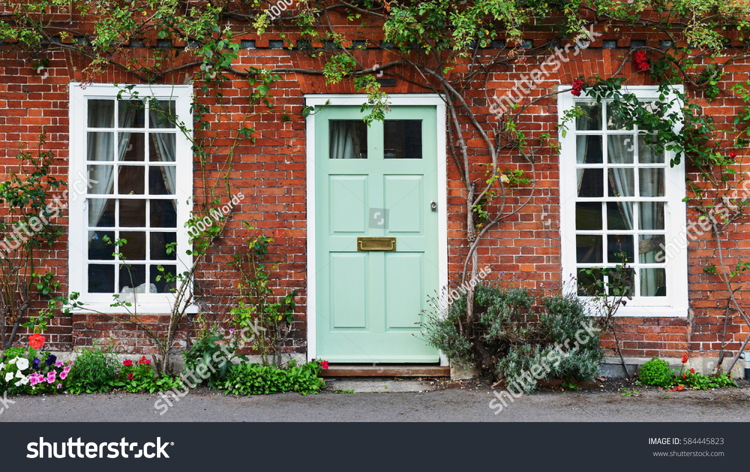 View of a Beautiful House Exterior and Front Door Seen on a London Street #584445823