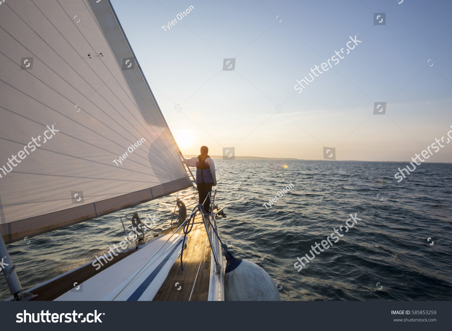 Man Looking At Beautiful Sea From Bow Of Sail Boat #585853259