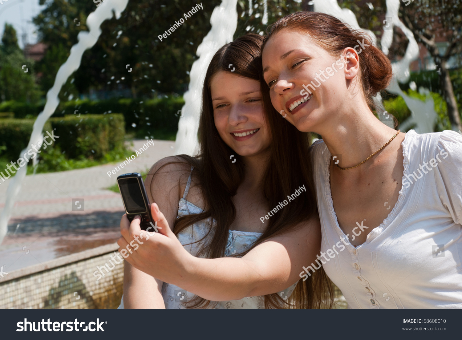 Happy mother and daughter in park #58608010