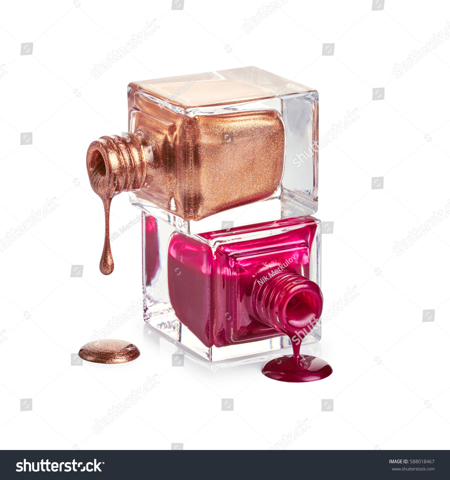 Bottles with spilled nail polish isolated on white background #588018467