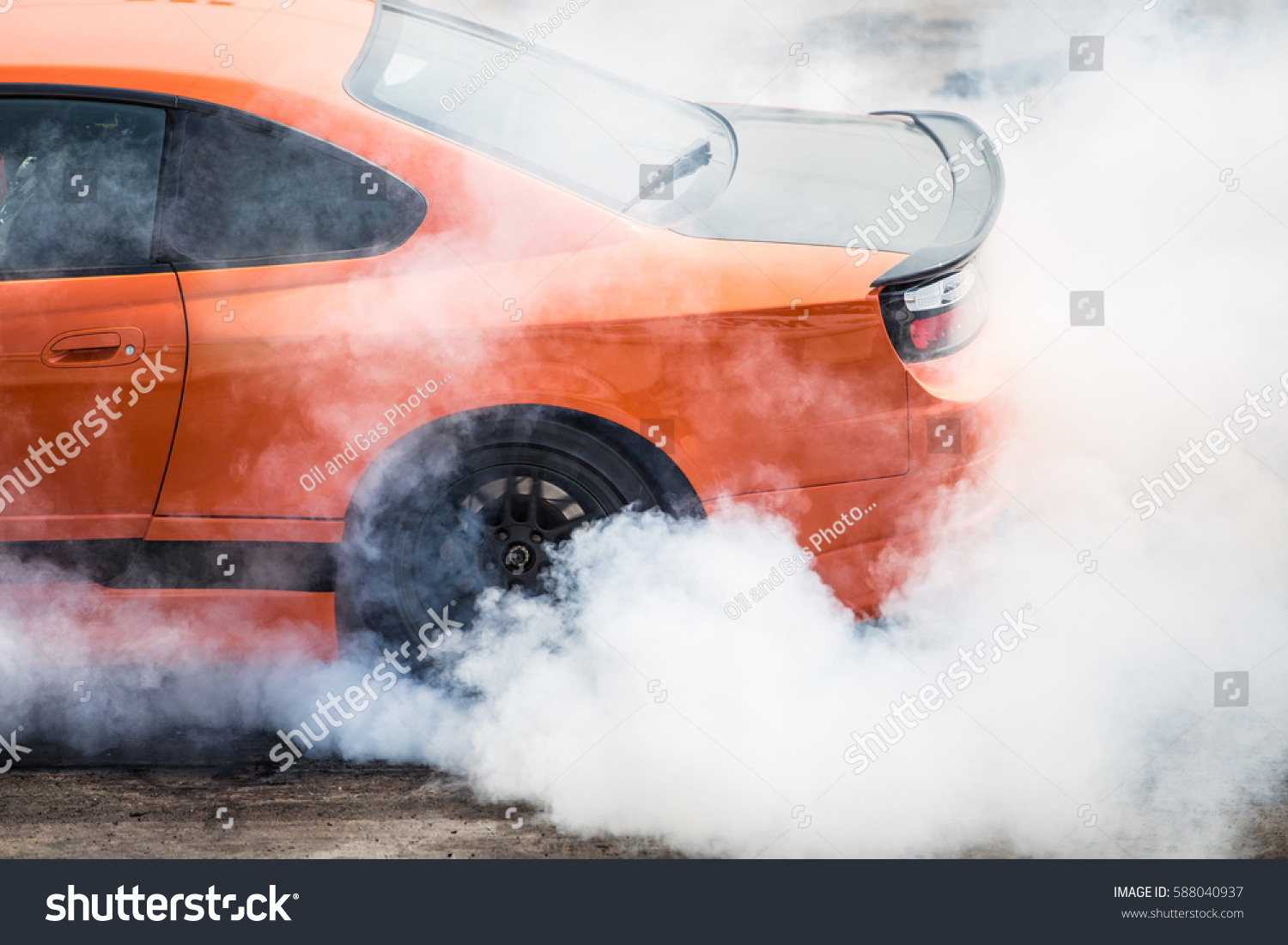 Rear wheel drive super sport car burning tire for warm up before competition to increase type temperature for good traction and grip. #588040937