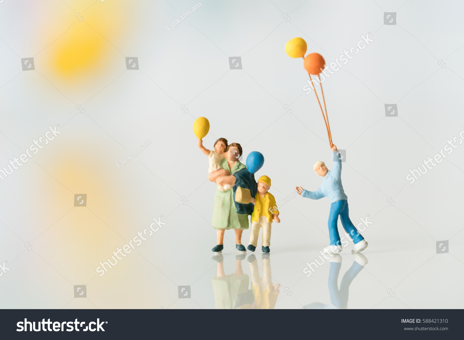 Miniature people with balloon using as background family or happy concept.. #588421310