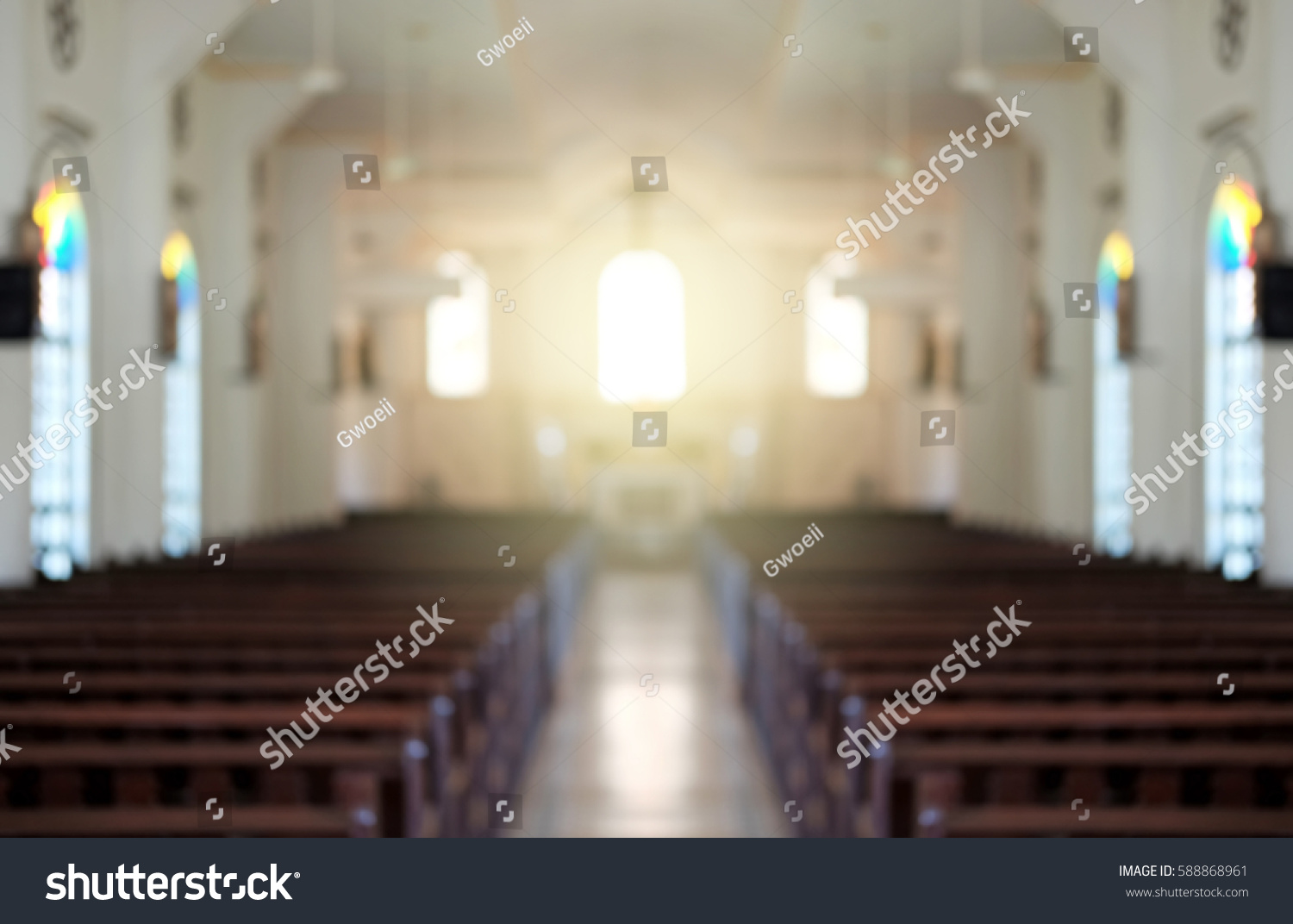 Blurred background of a surreal illuminated church aisle.
 #588868961