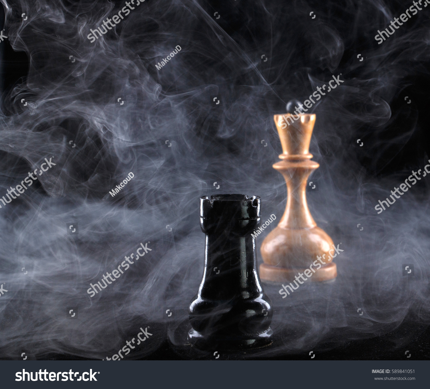 Two chess pieces in fog on black background #589841051