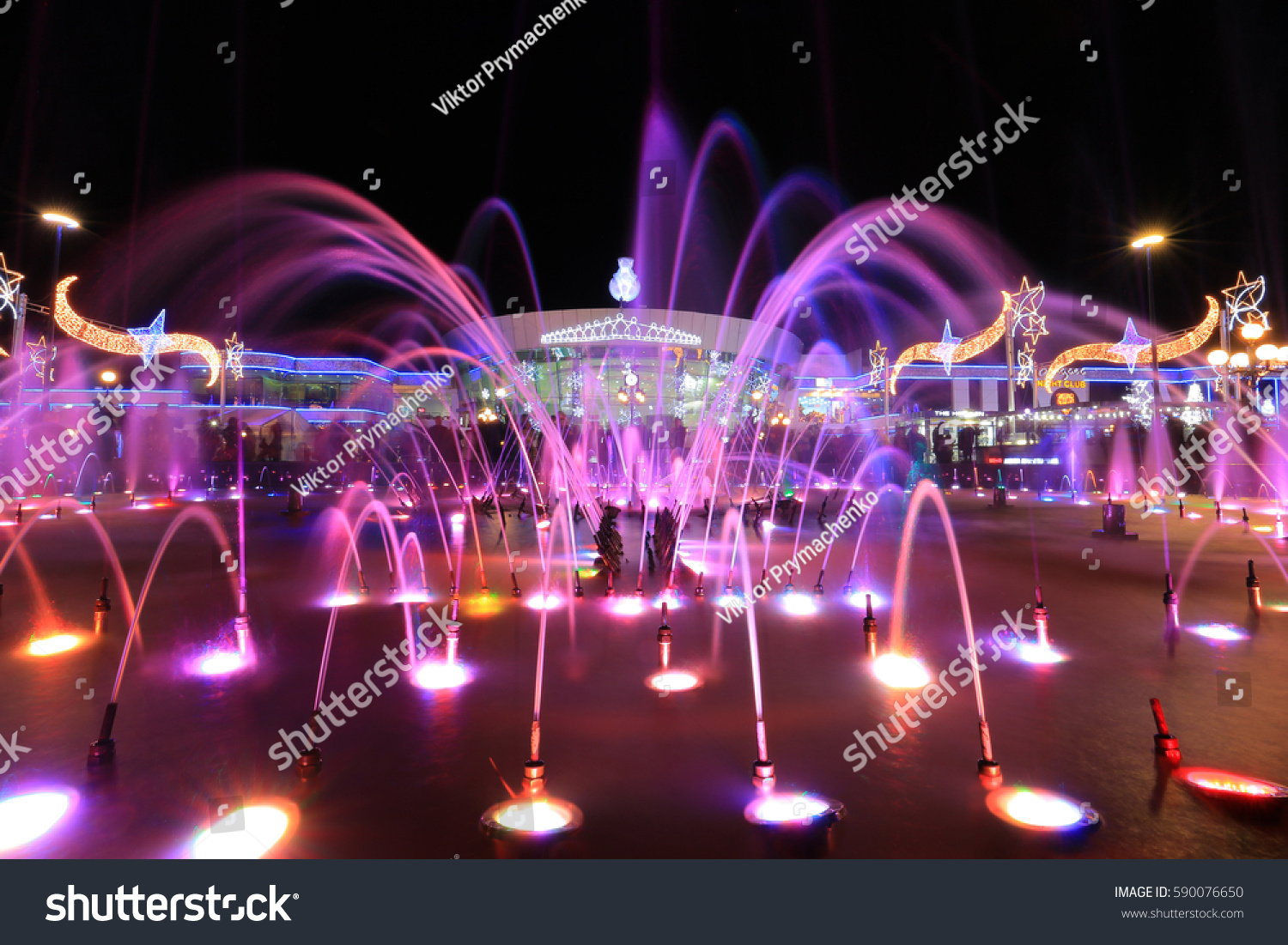Colorful fountain at night in Soho square in Sharm El Sheikh, Egypt #590076650