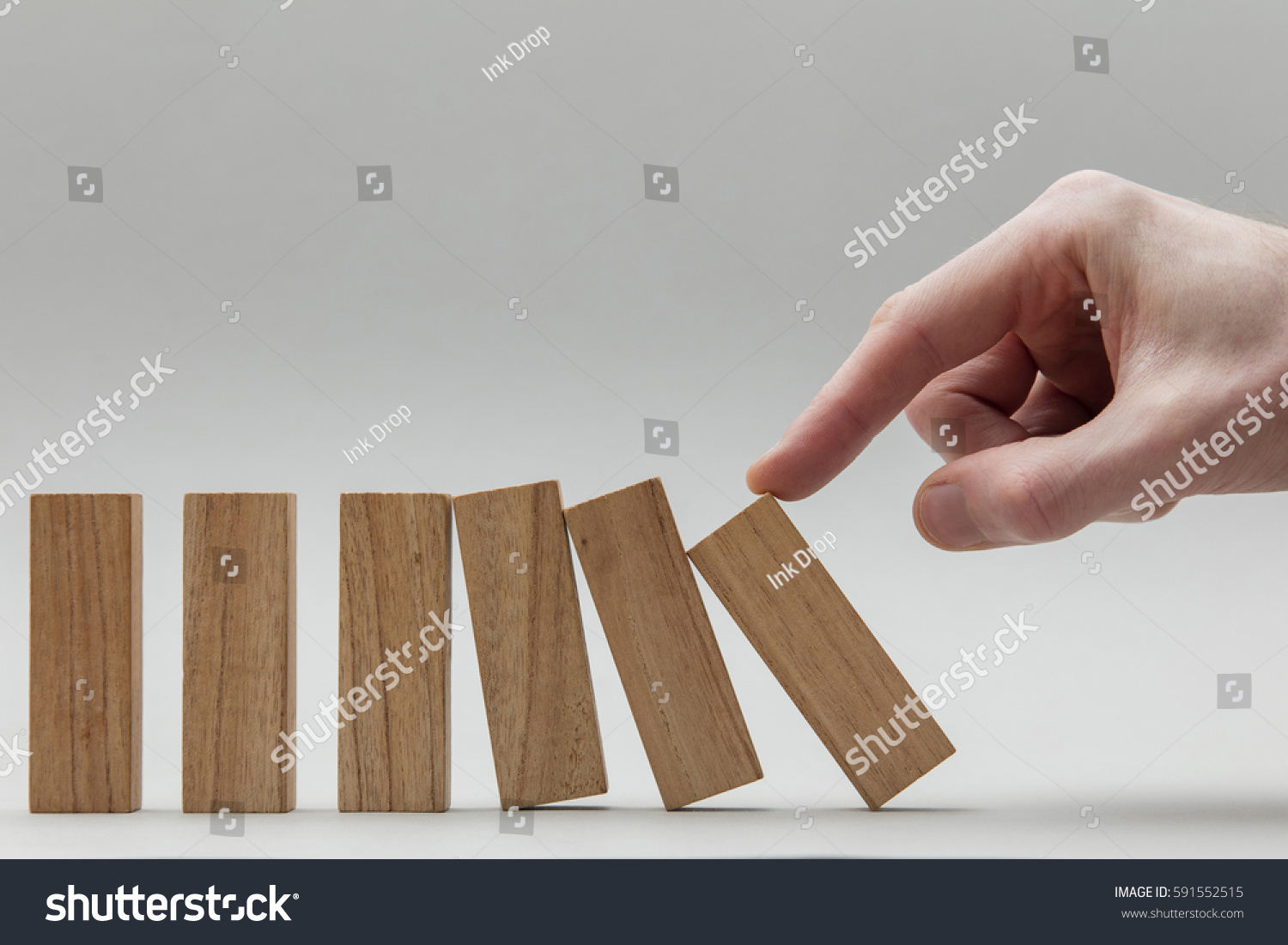 Male hand pushing over wooden blocks. Business development and growth concept
 #591552515