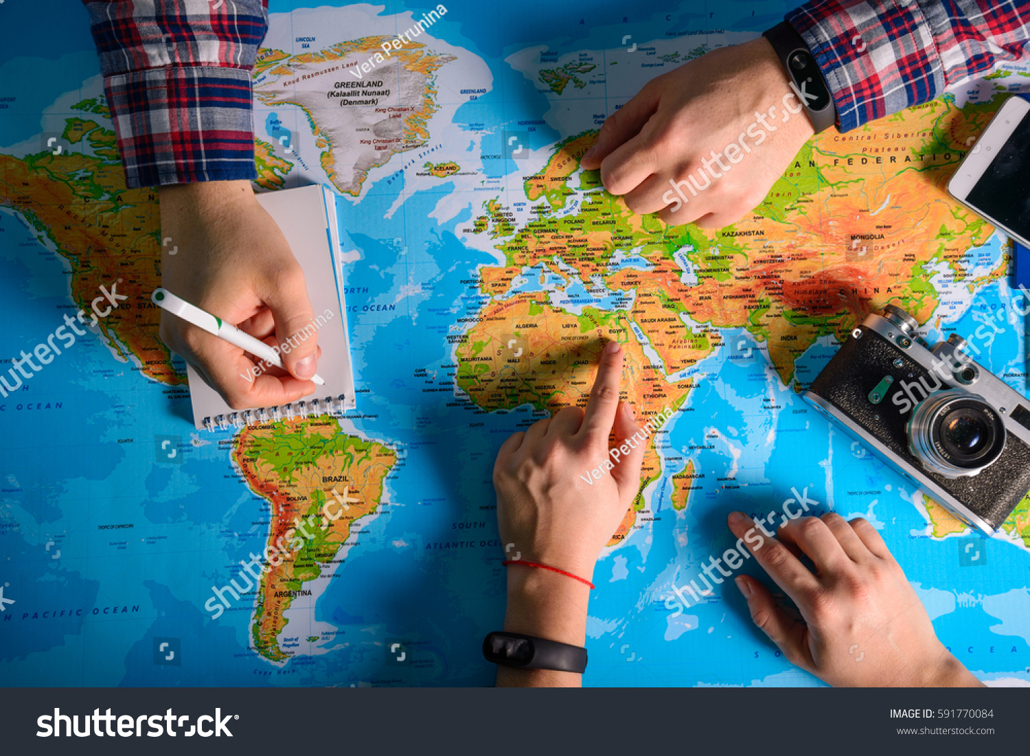hands point on map where to go travel planing vacation #591770084