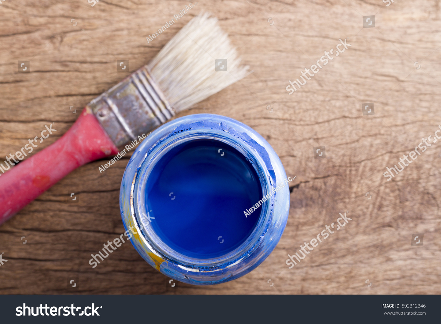 Old paintbrushes on wooden background
 #592312346