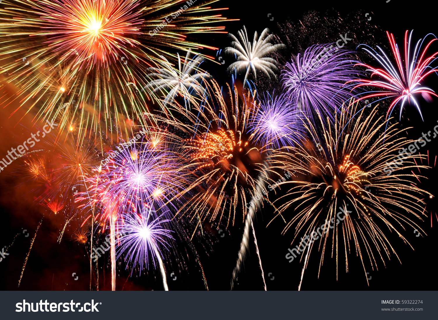 Fireworks of various colors bursting against a black background #59322274