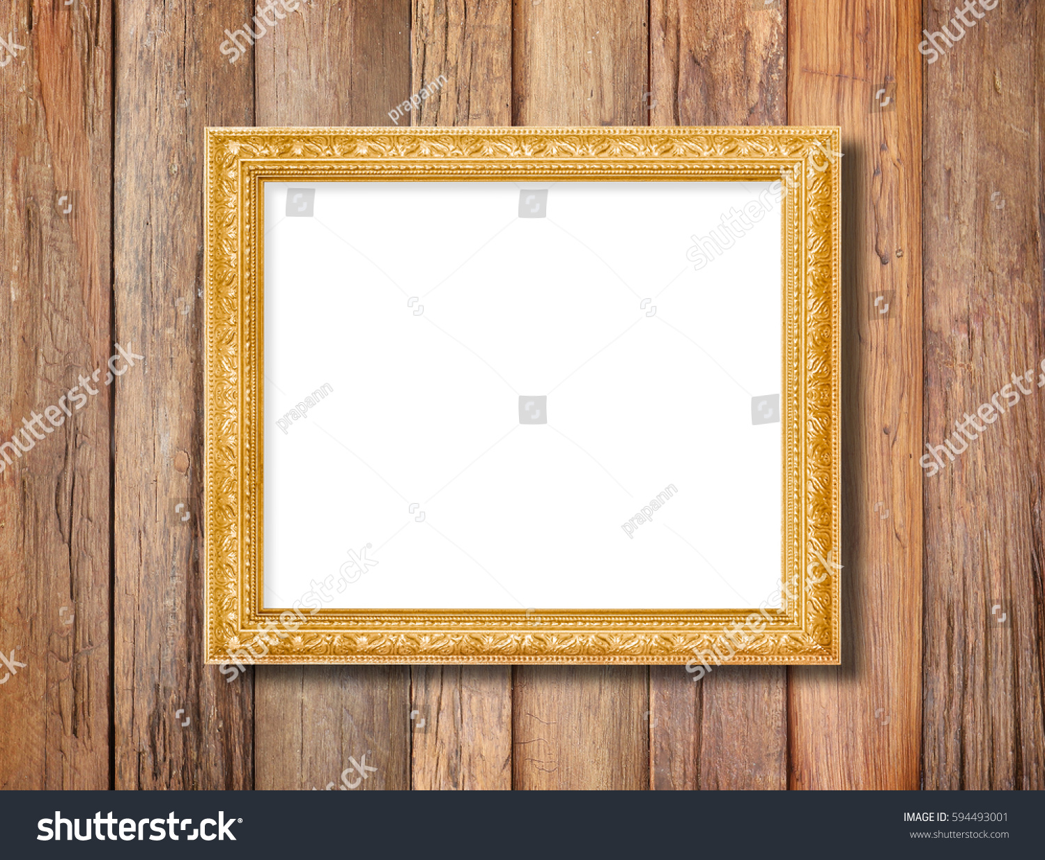 Antique gold frame on wooden wall background #594493001