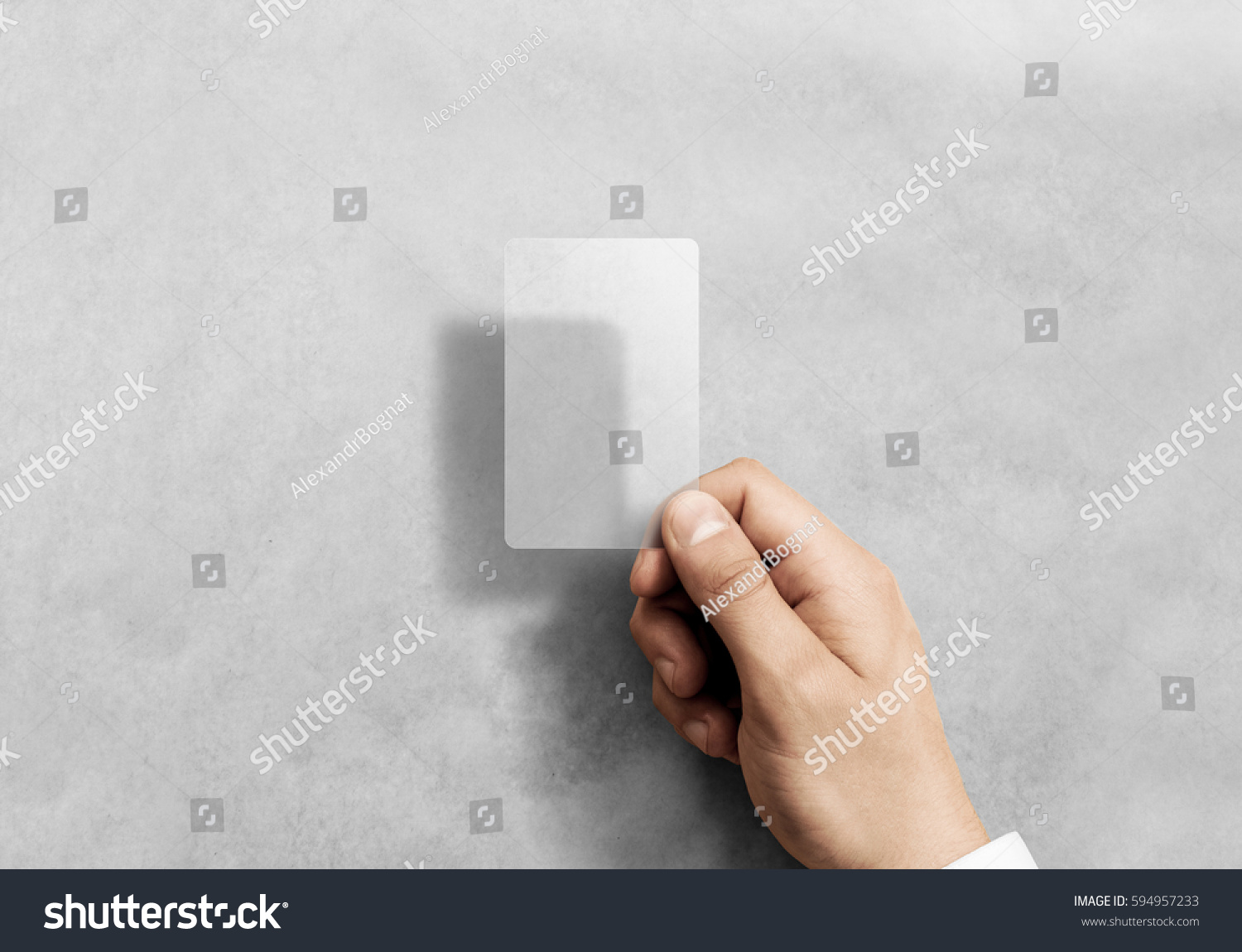 Hand hold blank vertical translucent card mockup with rounded corners. Plain clear call-card mock up template holding arm. Plastic transparent acrylic namecard display front. #594957233