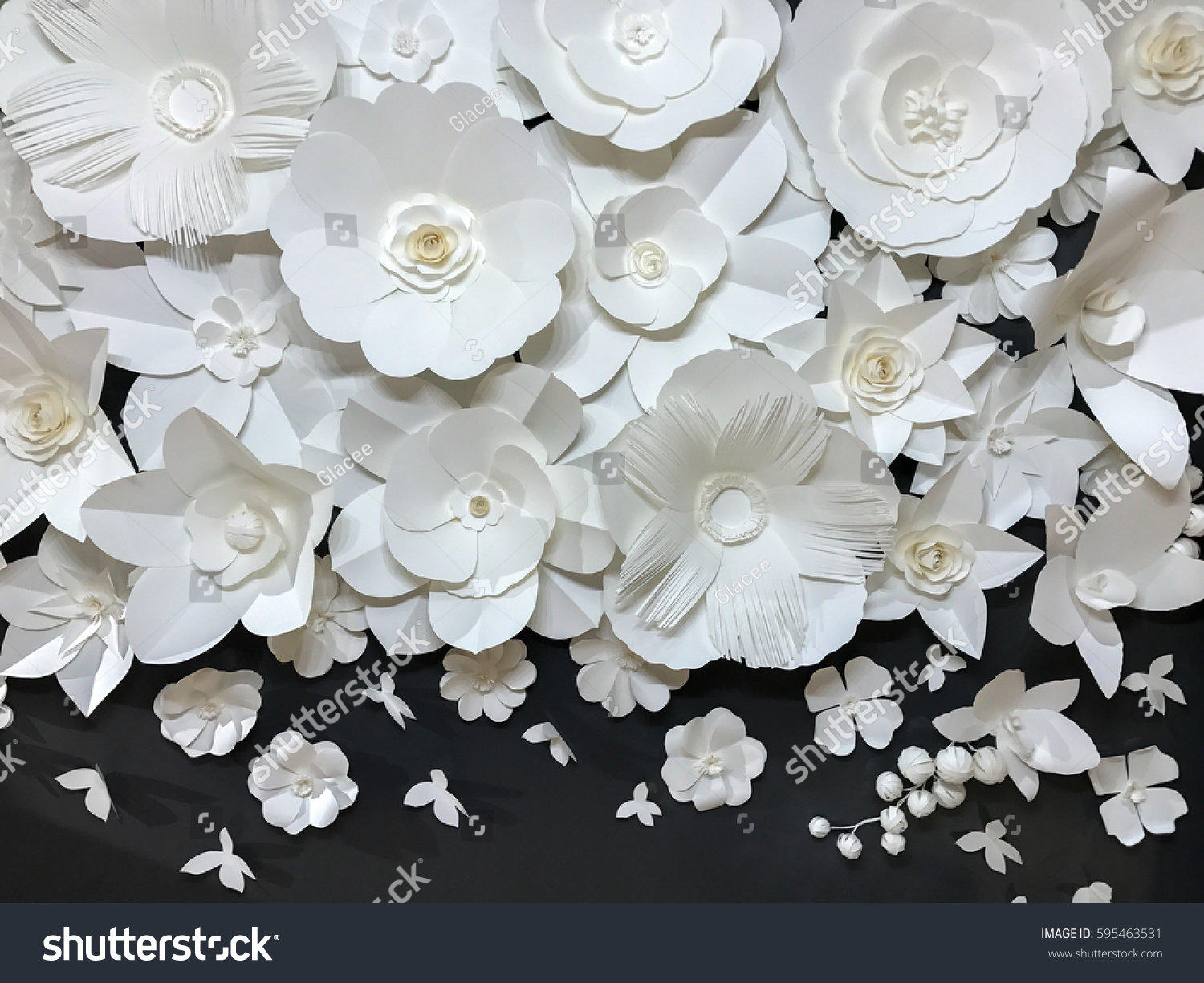 Beautiful Group of Variety Style Handmade Quilling White Floral Pattern with Small Butterfly made from Paper on Black Fabric Wall Background used as Template of Flowers Interior Vintage Retro Style #595463531