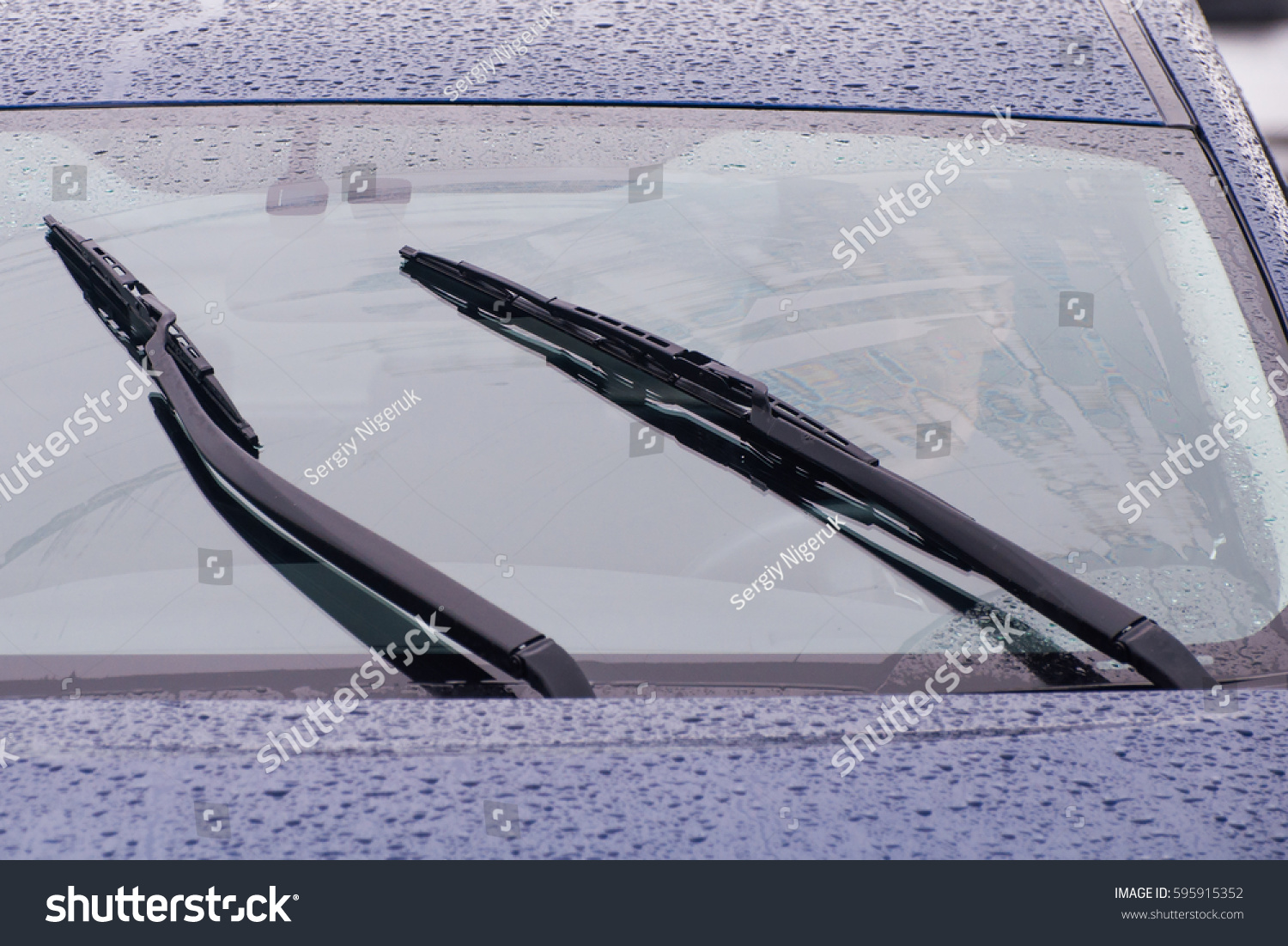 view of the car windshield wipers in the rain #595915352
