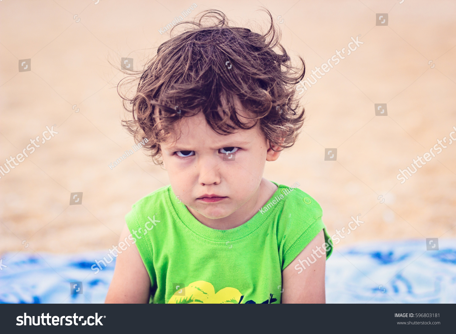 Portrait of toddler boy with angry upset face expression #596803181
