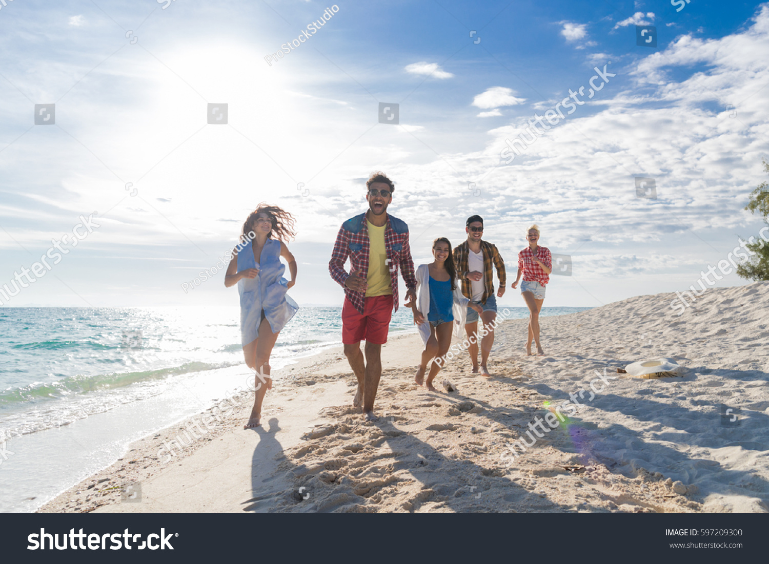 Young People Group On Beach Summer Vacation, Happy Smiling Friends Walking Seaside Sea Ocean Holiday Travel #597209300