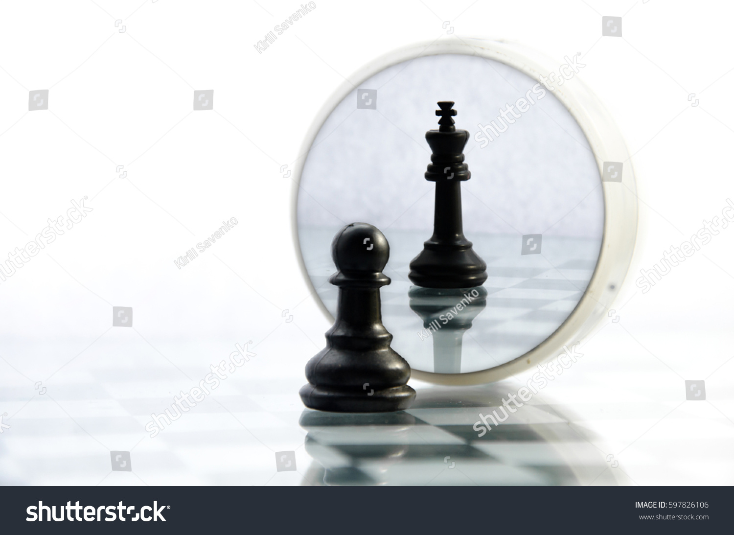 pawn pieces on the chessboard, the reflection in the mirror king, often in life things and people are not what they seem #597826106