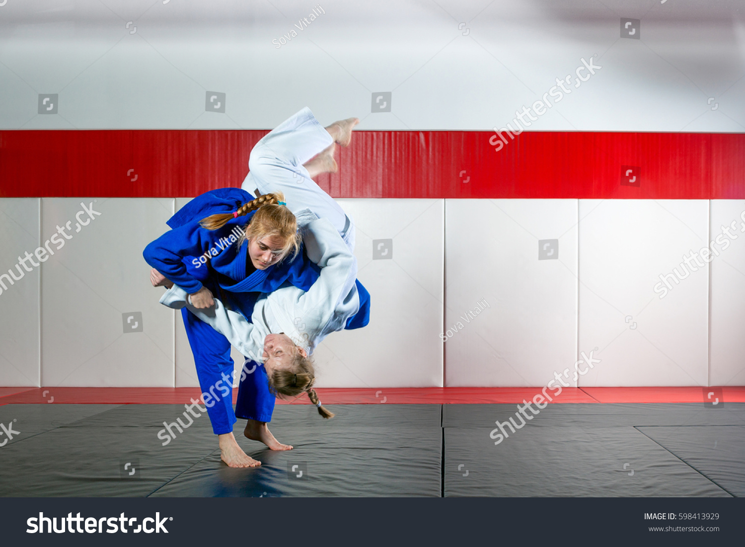 Two women fight judo on tatami #598413929