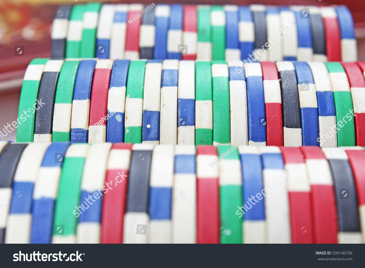 Casino poker money chips texture. Stack of poker chips as background.  #599140736