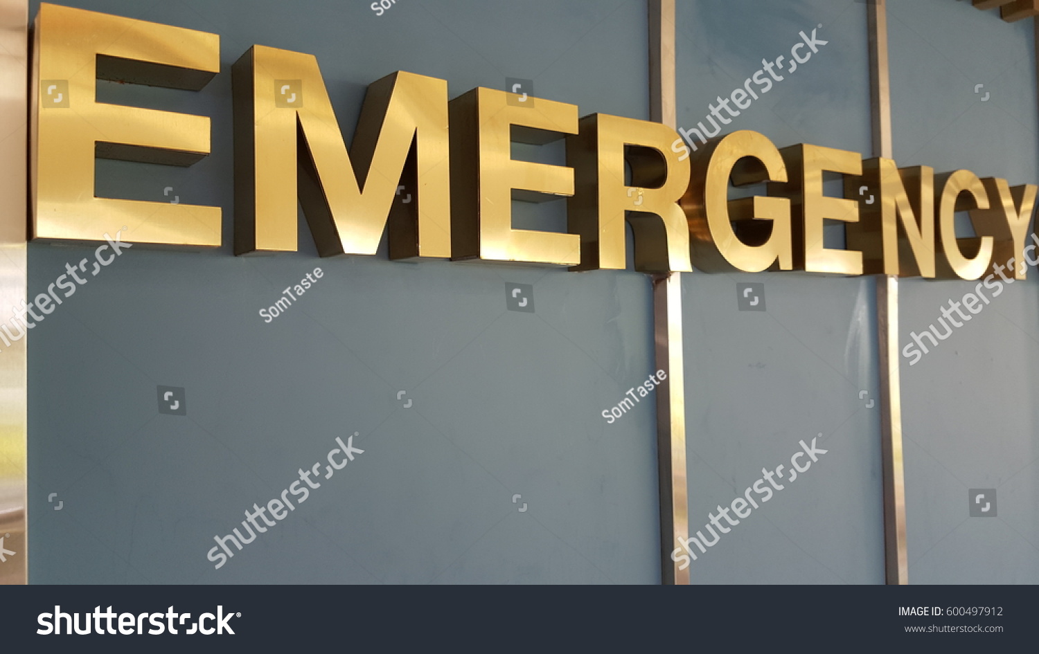 Close up photo of red large letters spelling emergency #600497912
