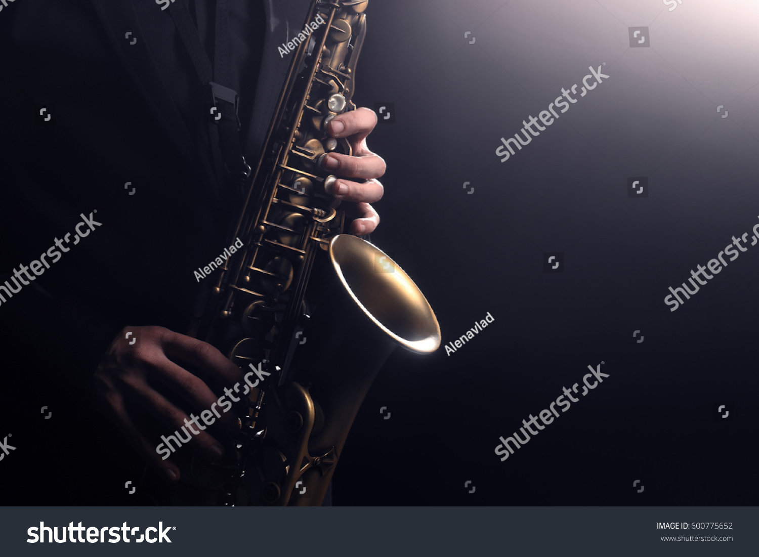 Saxophone player Saxophonist playing jazz music instrument Jazz musician playing sax alto #600775652