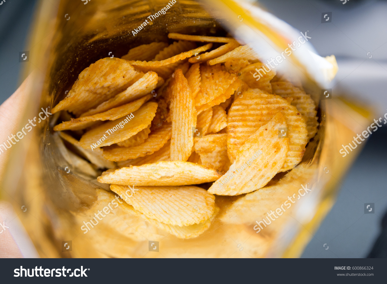 Potato chips is snack in bag ready to eat and fat food or junk food., Potato Chips in a Ready-to-Eat Bag. #600866324