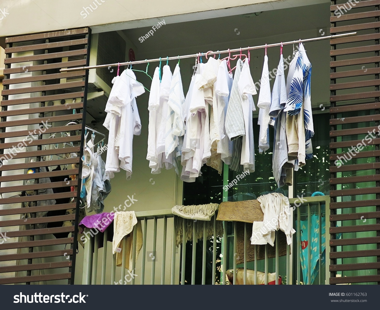 Drying clothes on the balcony of the condo on the day without the sun from the sun #601162763