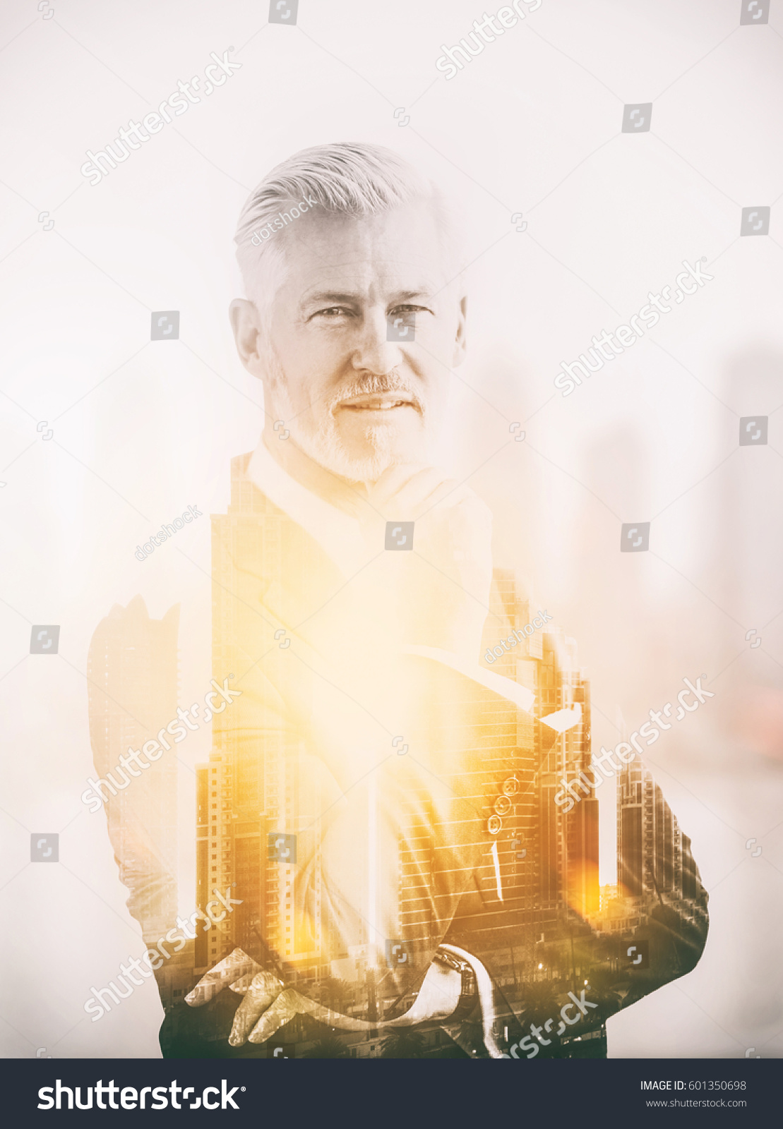 Double exposure of senior businessman in front of the big city #601350698