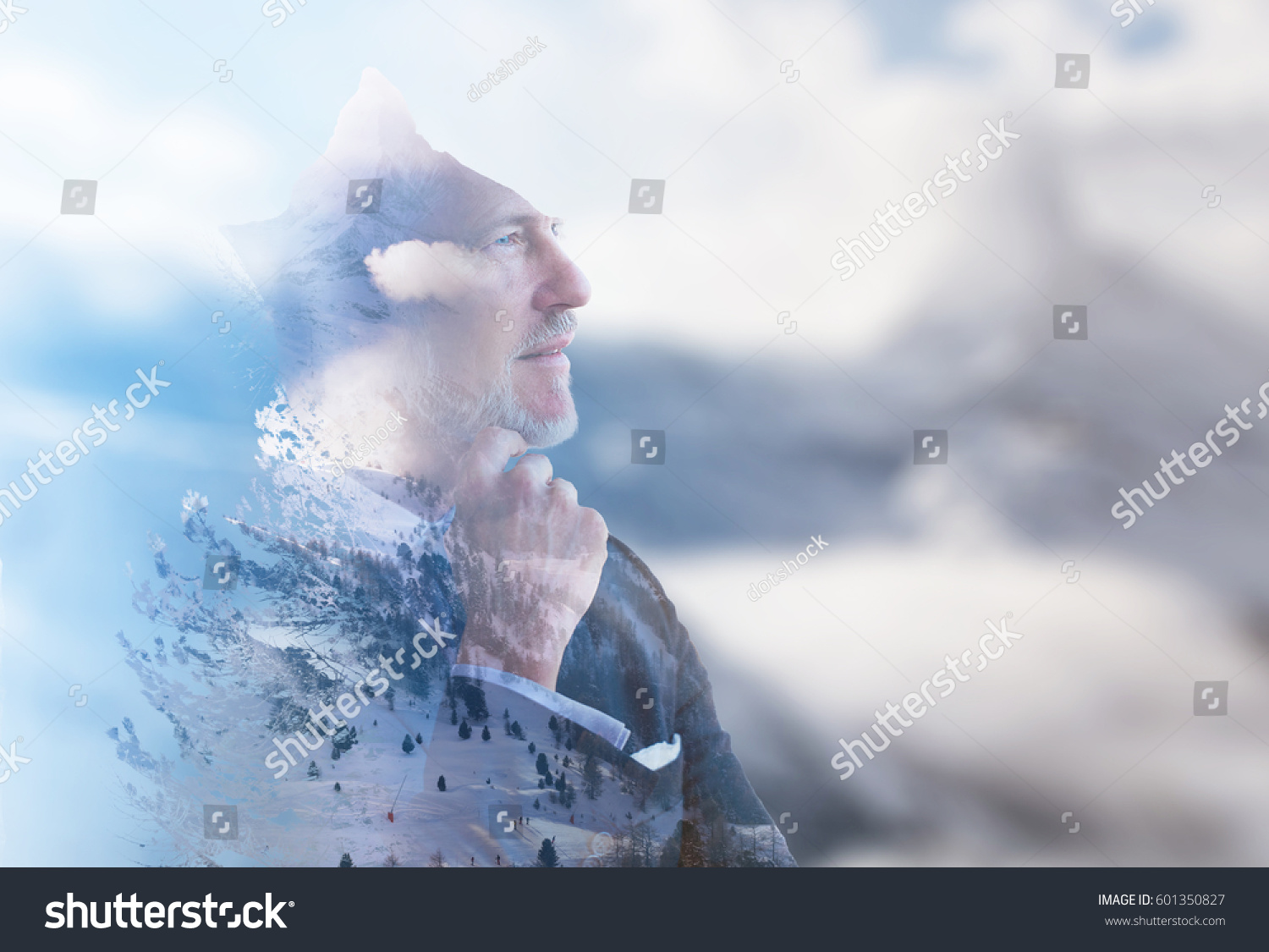Double exposure of senior businessman in front of the big  mountain #601350827