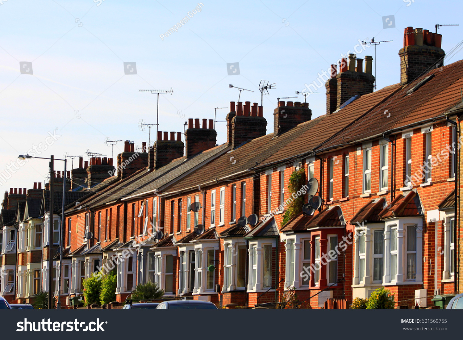 English row terrace house in spring season, England UK. Brick building in the town. #601569755