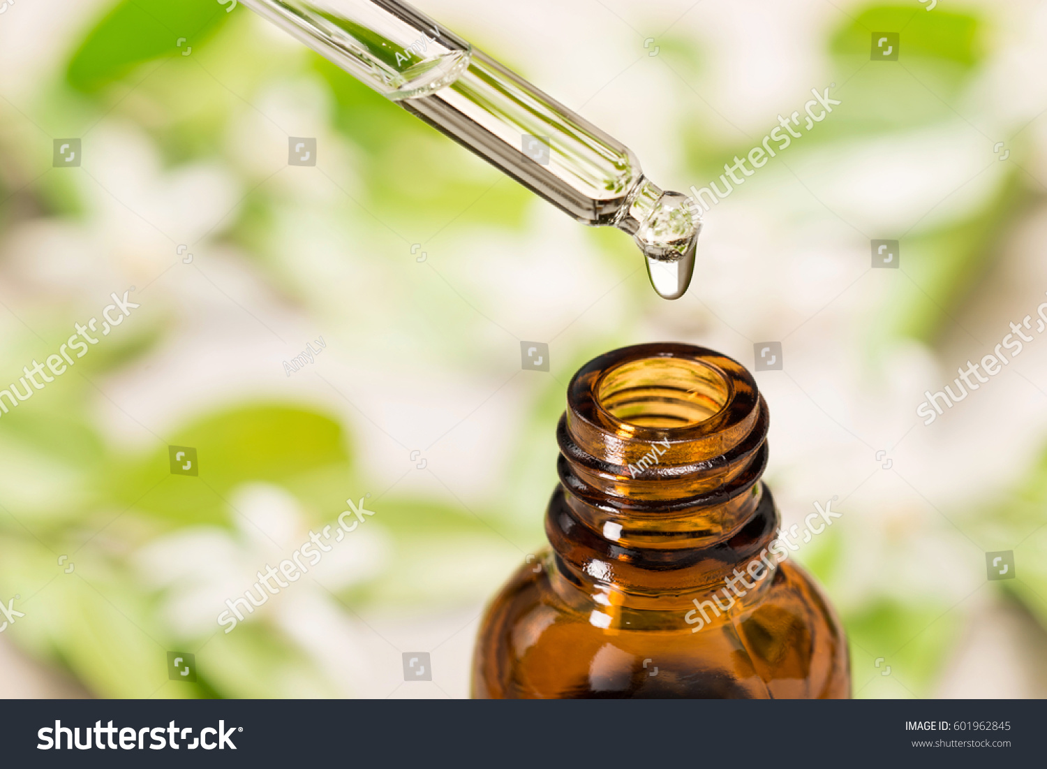 essential oil falling from glass dropper #601962845