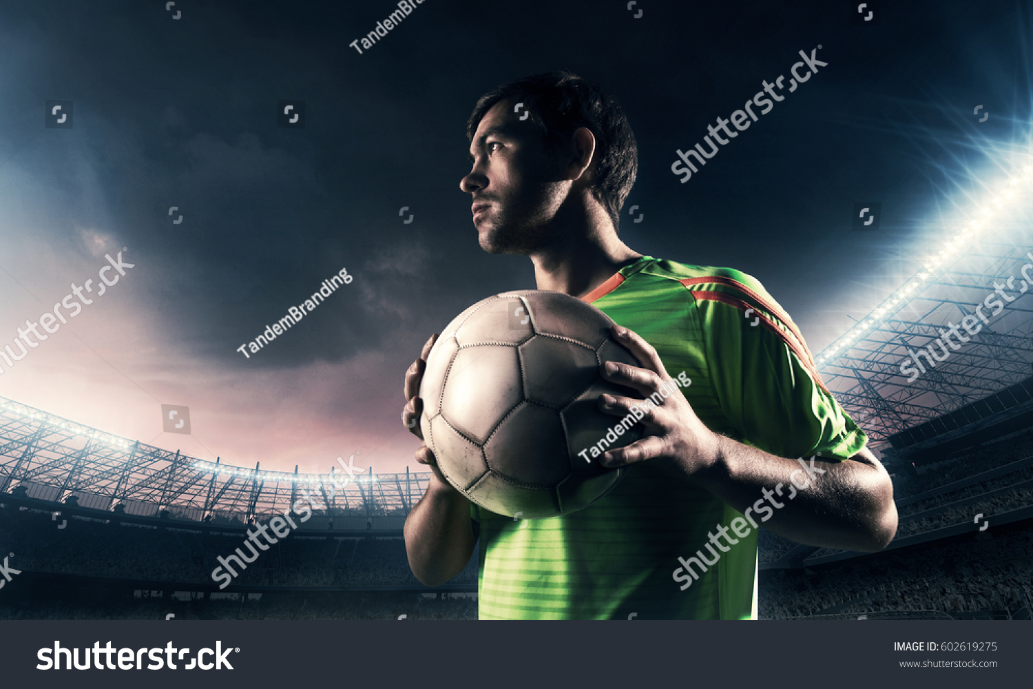 soccer player on a field with a ball  #602619275