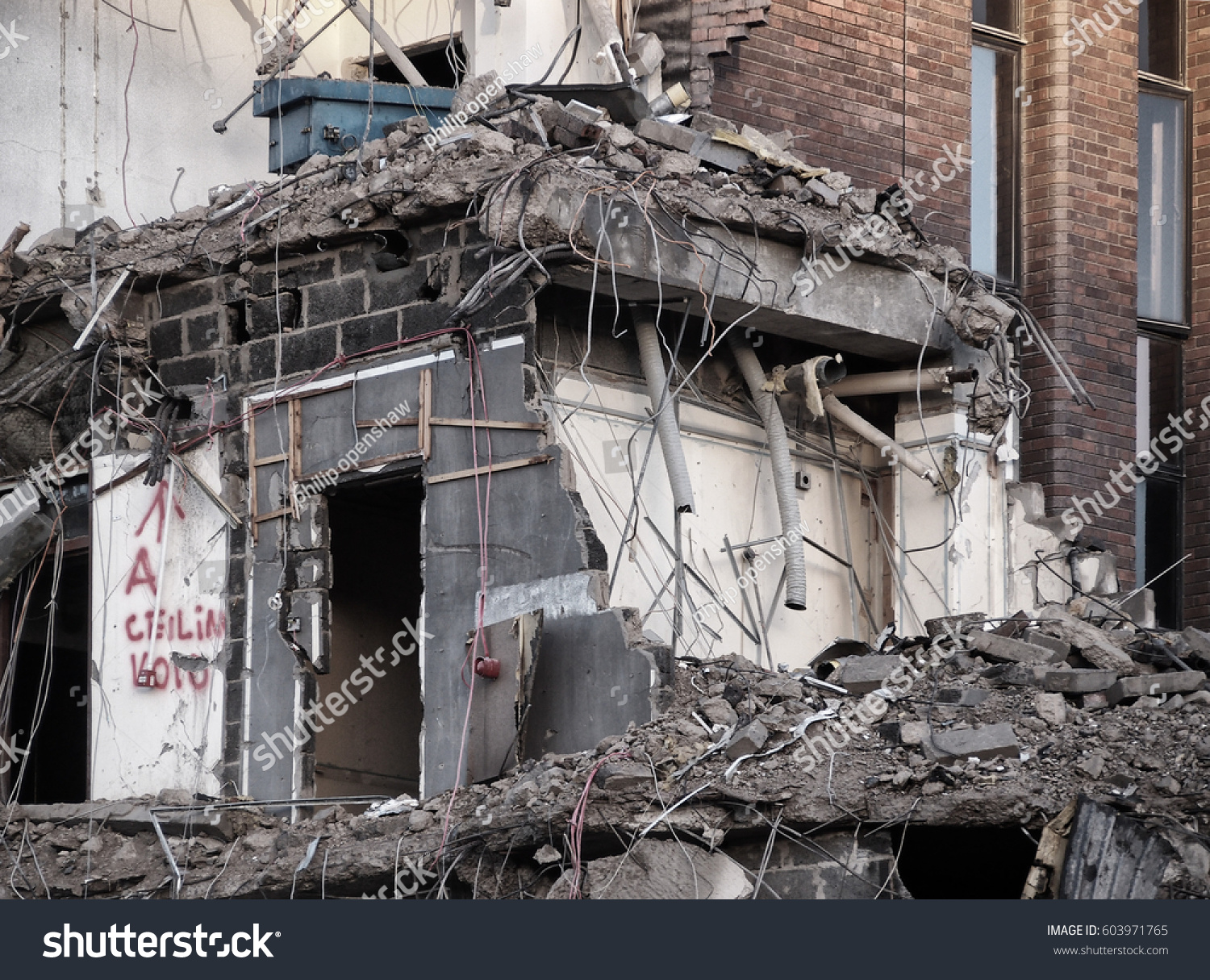 Demolition site, details of a large building being destroyed.  #603971765
