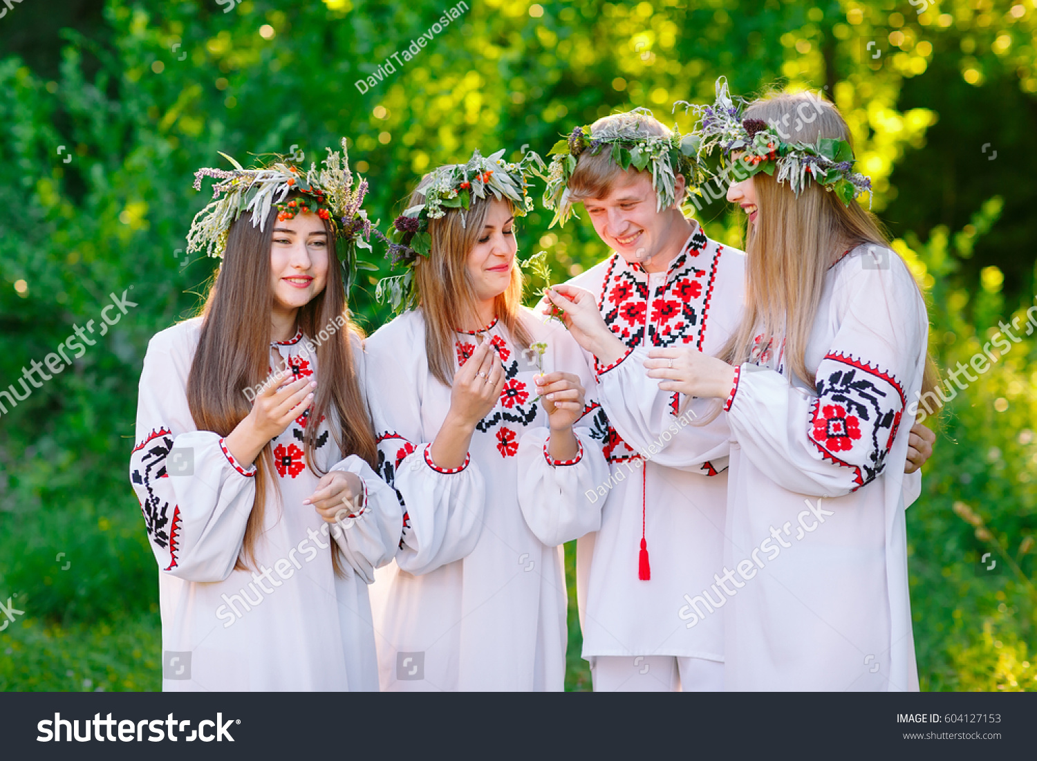Midsummer. A group of young people of Slavic appearance at the celebration of Midsummer. #604127153