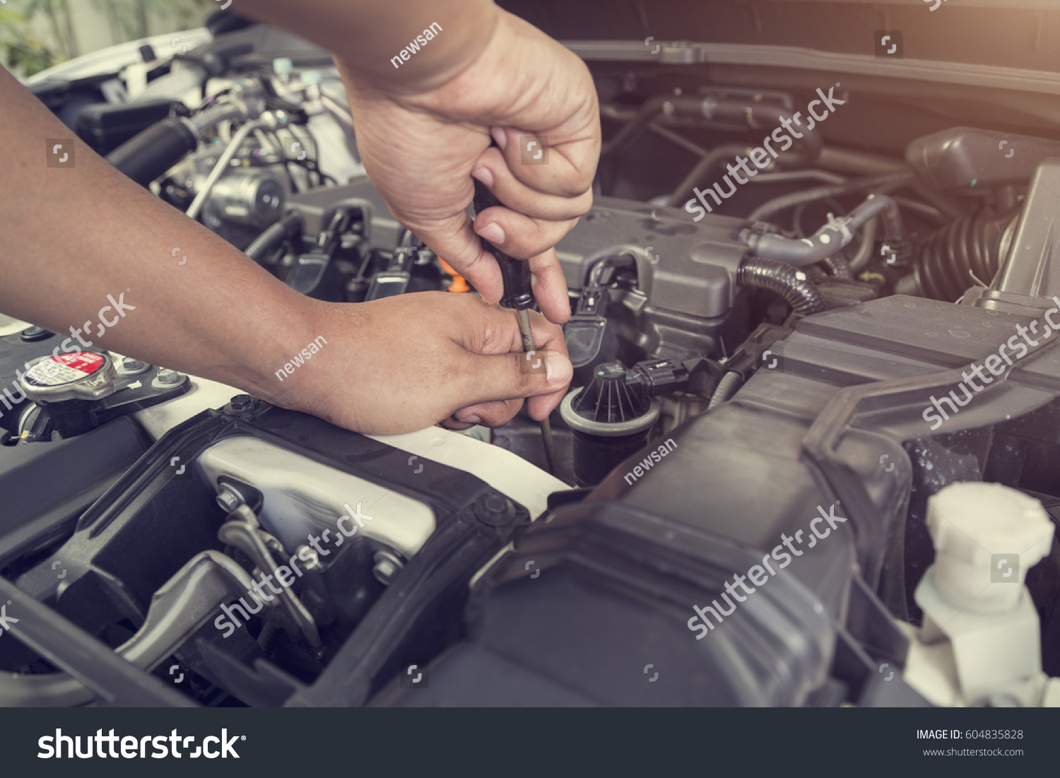 Professional car mechanic working in auto repair service  #604835828