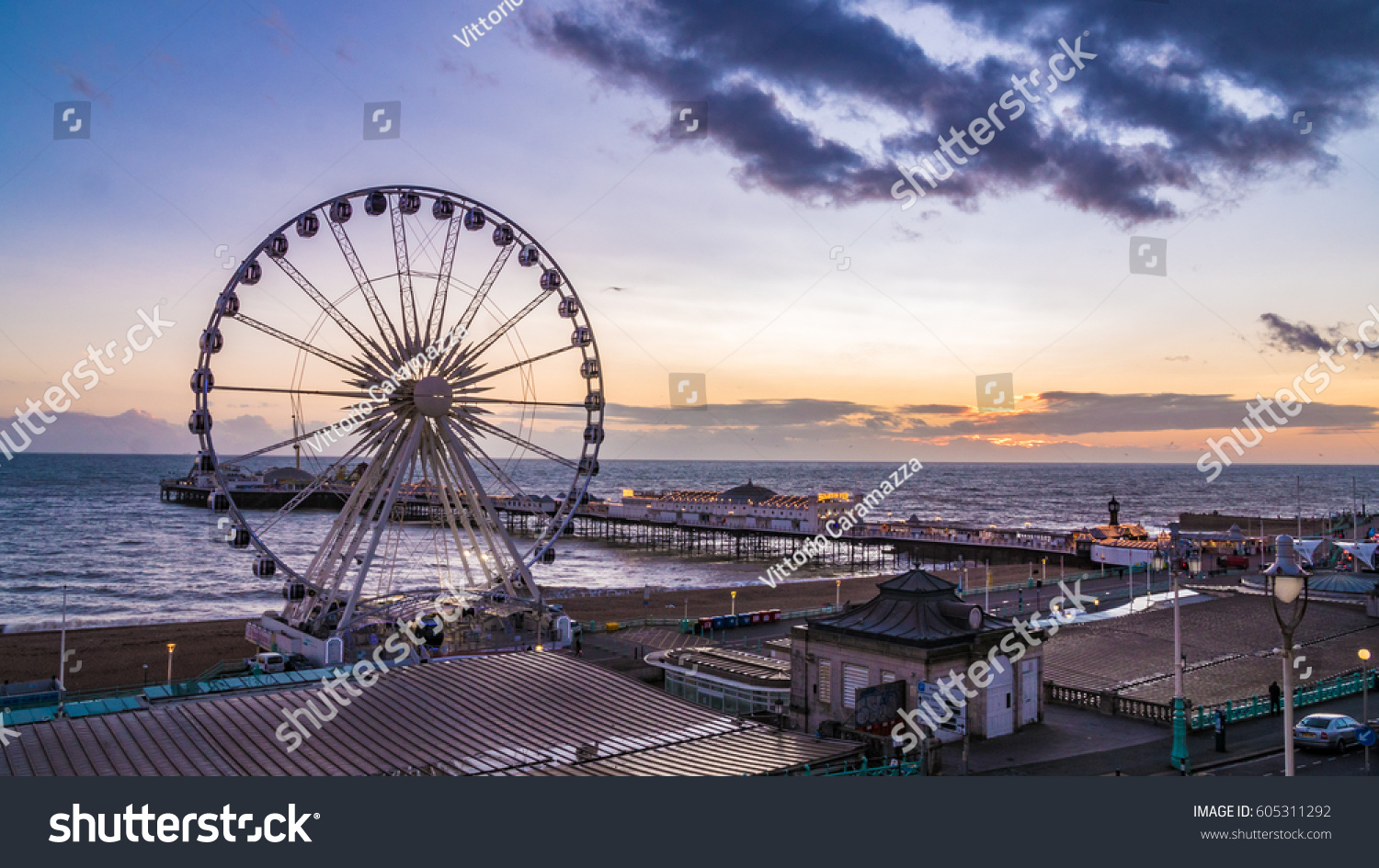 The Victorian Brighton Pier, also known as the Palace Pier and the Brighton wheel at sunset #605311292